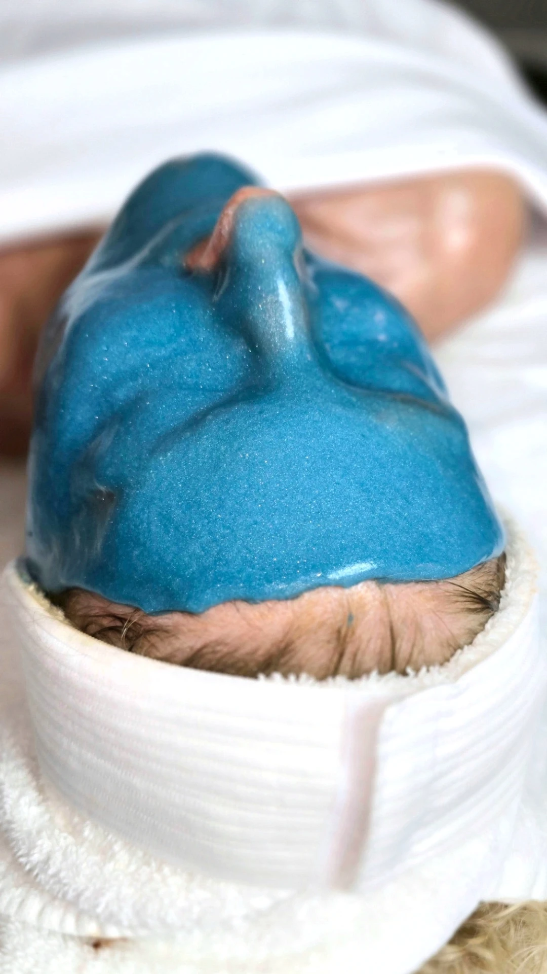 Professional jelly mask applied during a spa facial treatment for hydration and skin comfort